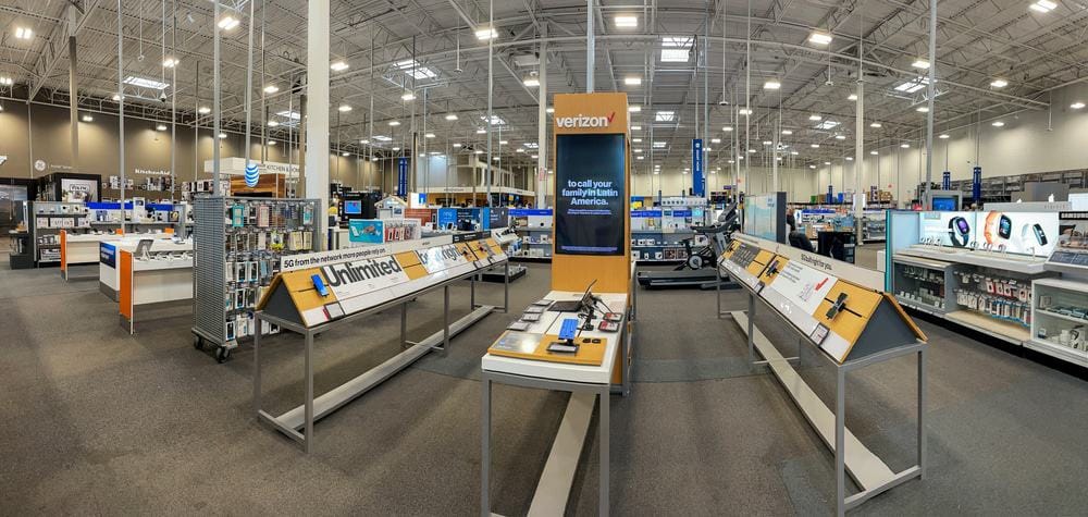 The inside of a large electronics store buzzing with retail spending.