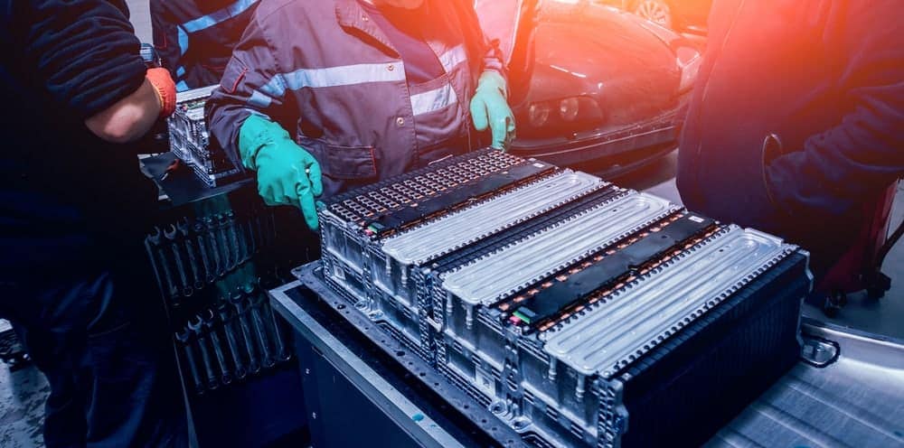 A group of workers are assembling batteries for WATT Fuel Cell cars.