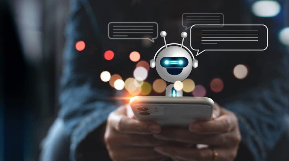 A person holding a phone with an AI Chatbot on it.