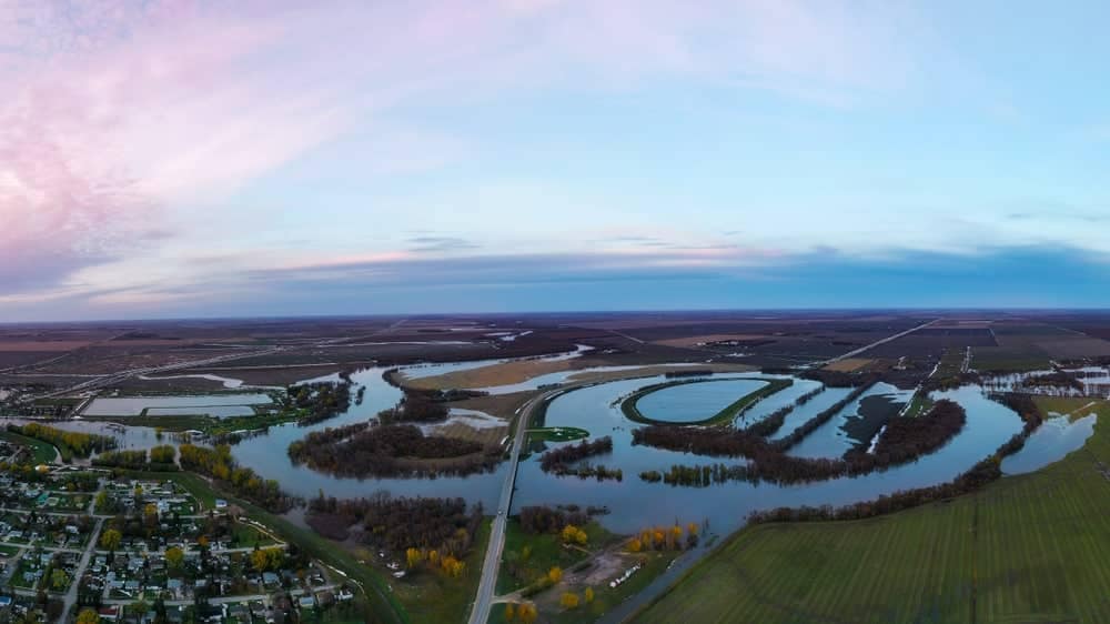An aerial view of a river town in Manitoba.