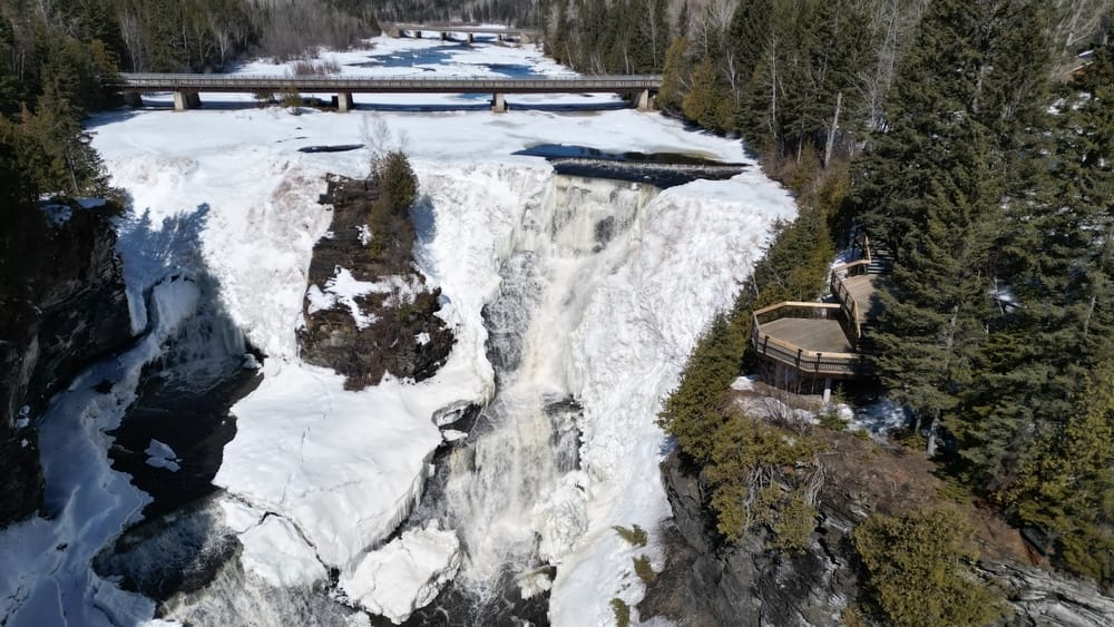 An aerial view of a winter waterfall in Ontario.