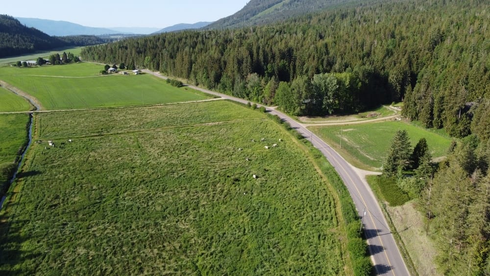 An aerial view of a road in the North Okanagan mountains.