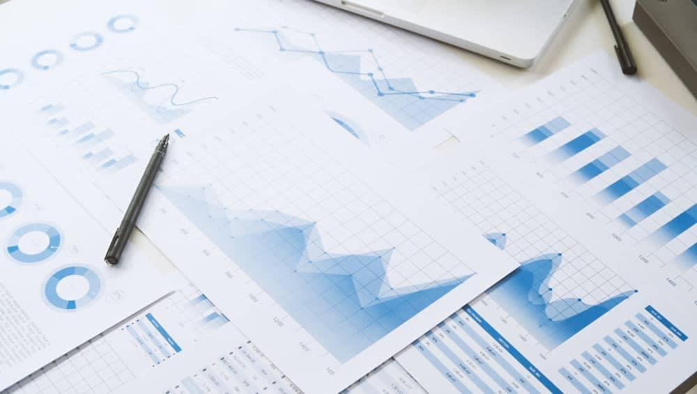 A desk with financial results and graphs on it, representing lazydays during the 2nd Quarter.