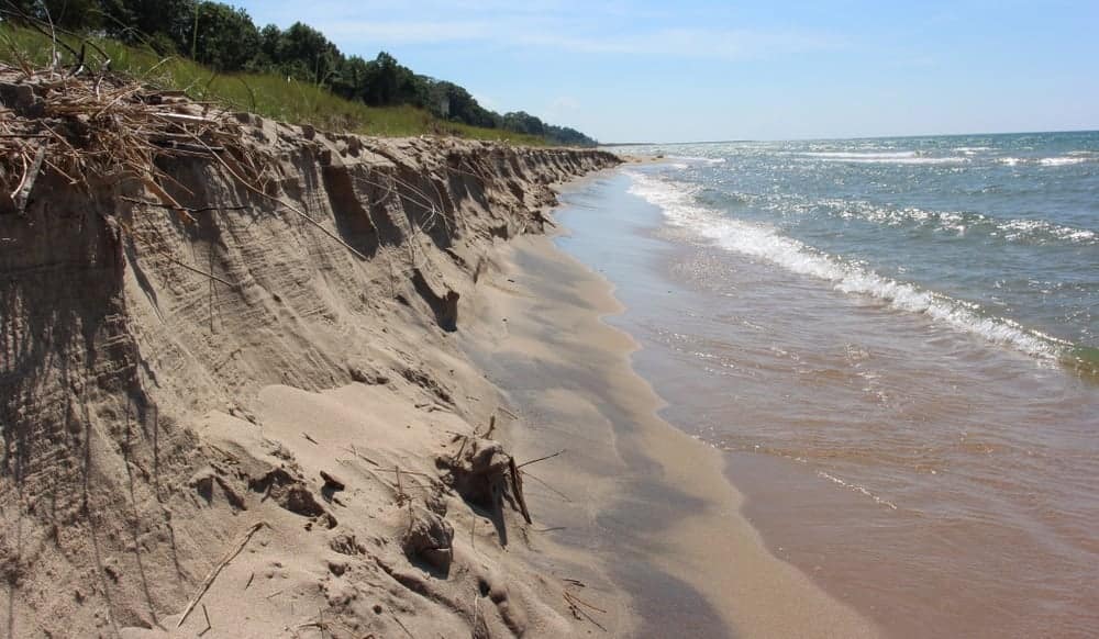 A sand dune on the shore of a lake in Michigan County Park.