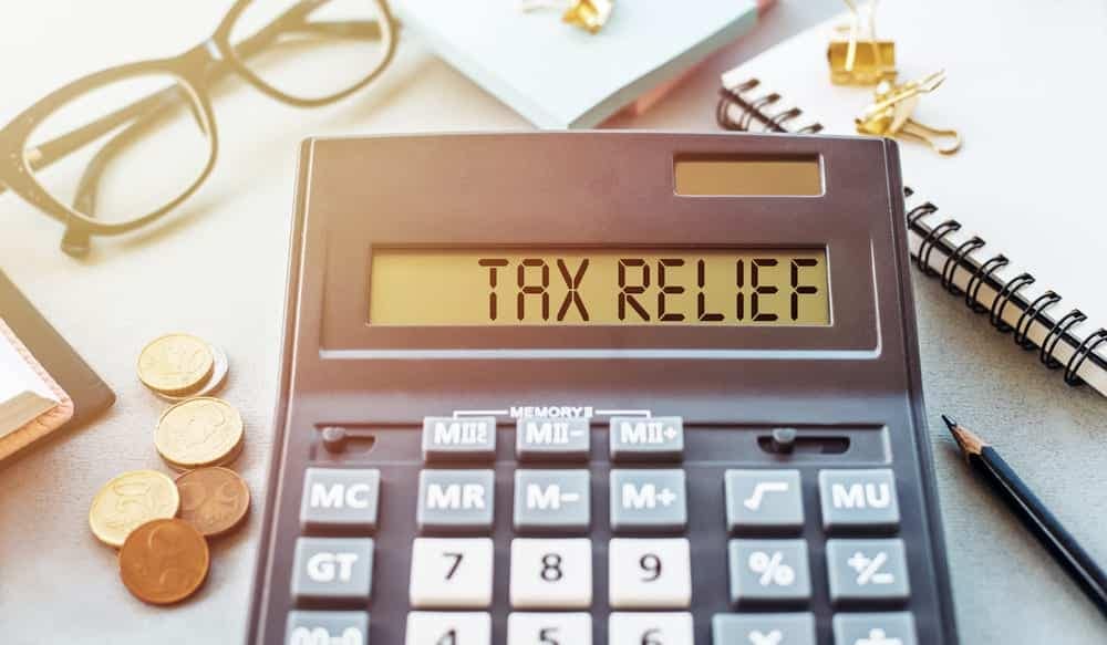 A calculator featuring the text "tax relief" prominently displayed.