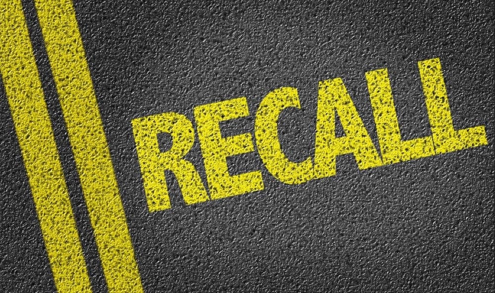 A road with the word recall written on it indicating vehicle recalls and safety concerns for RV manufacturers.