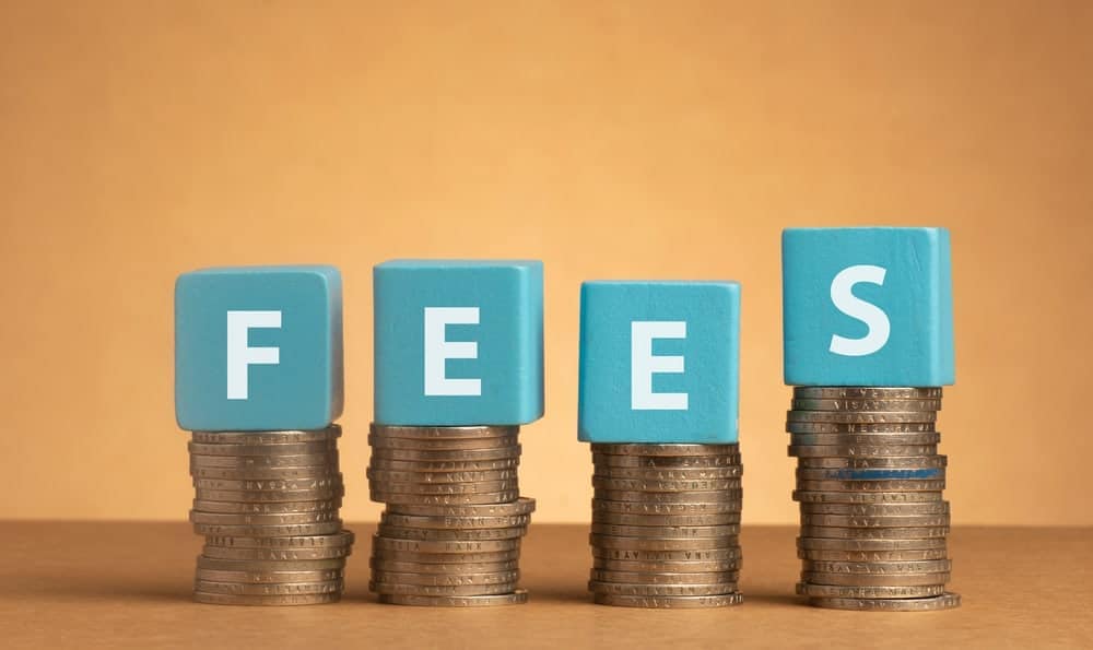A stack of coins with the word fees written on them increases at the Iroquois Municipal Campground.