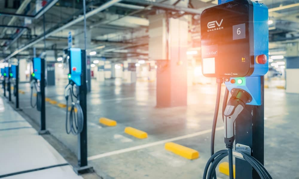 Electric Vehicle Charging Infrastructure implemented in an empty parking lot, in response to the EV Sales Surge facilitated by the B.C. Gov't.