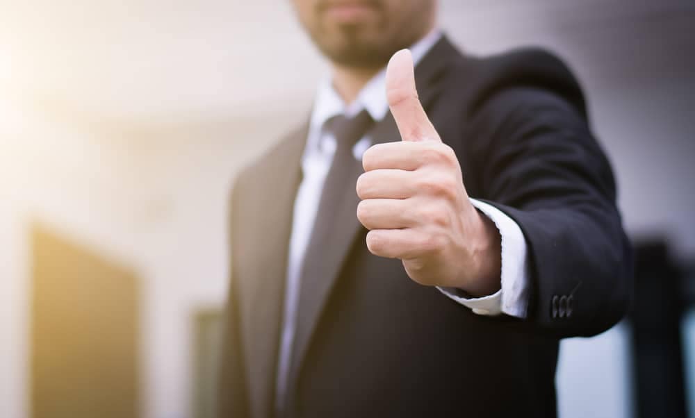 Businessman giving thumbs up - thumbs up stock photos.