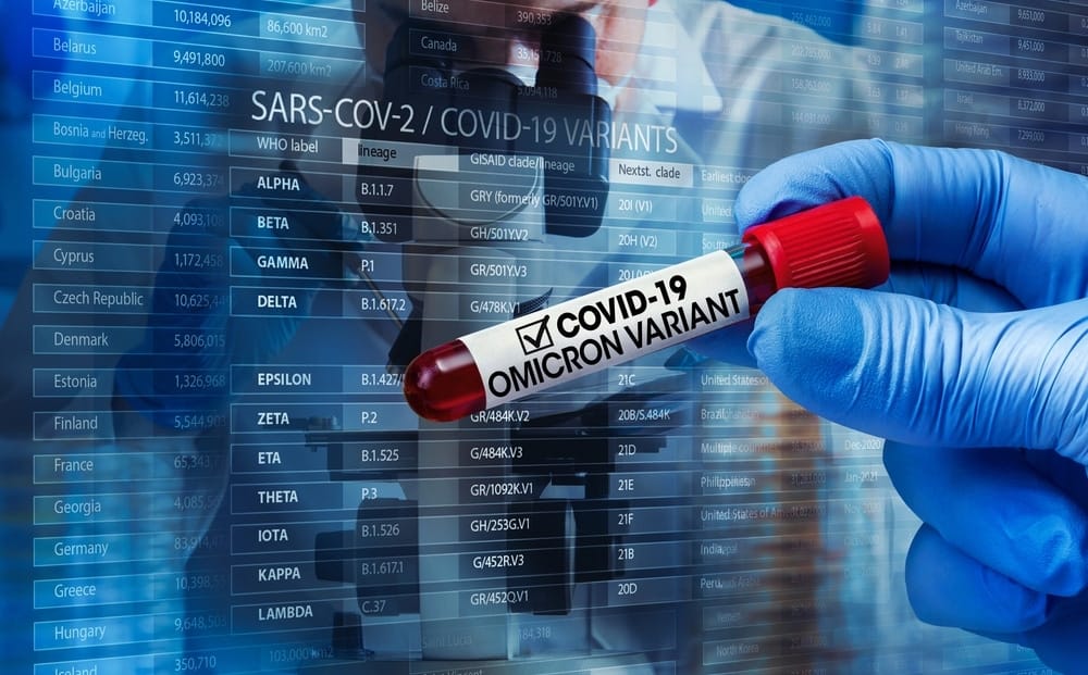 A doctor holding a blood sample with the word covid-19 written on it to conduct tests for the Omicron Variant.