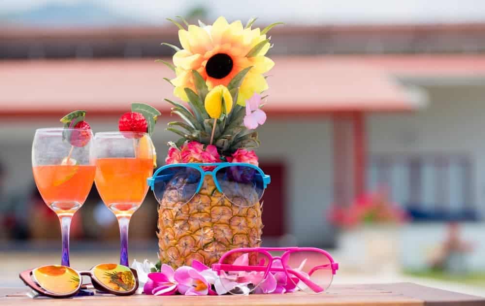 A pineapple with glasses and sunglasses on a table at the Old Forge Camping Resort during the camping season.