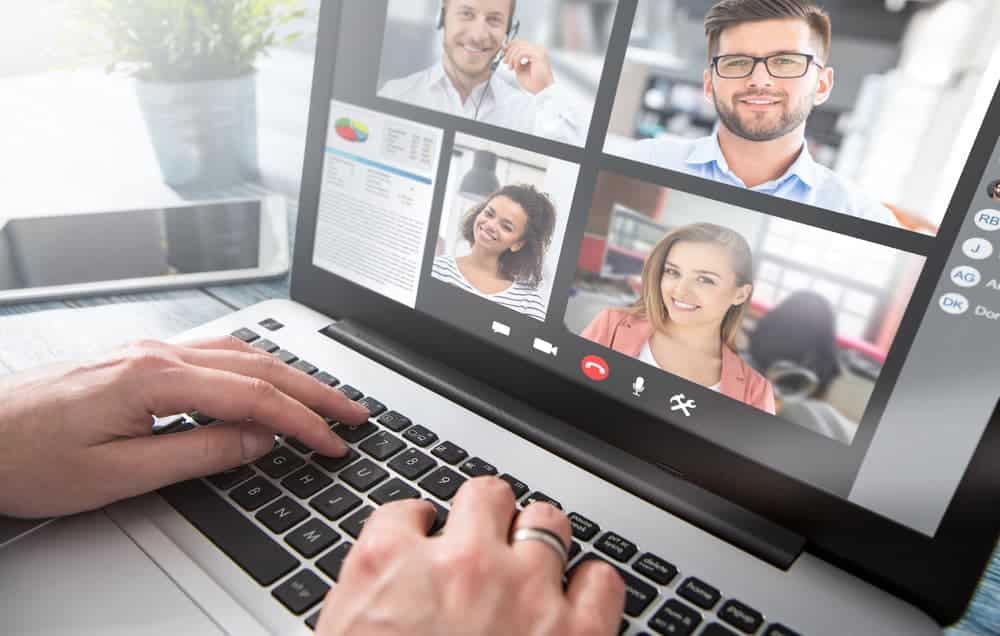 A person is using a laptop for a video call on it while exploring next generation technologies.
