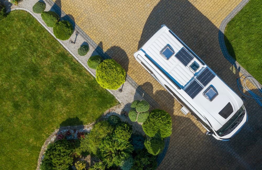 An aerial view of an RV parked in a driveway, showcasing outdoor hospitality.
