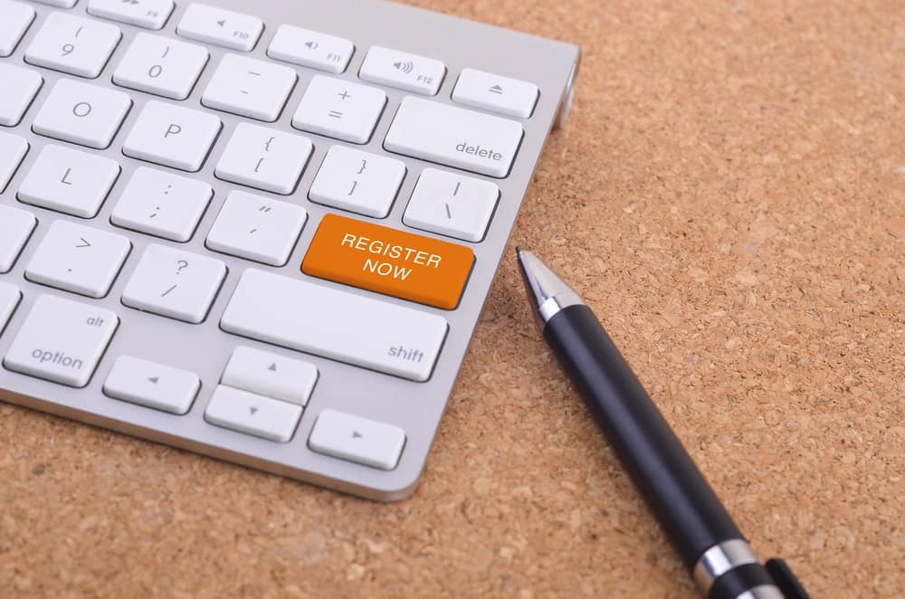 A computer keyboard with a pen next to it at the Virginia Campground Association Annual Meeting tradeshow.