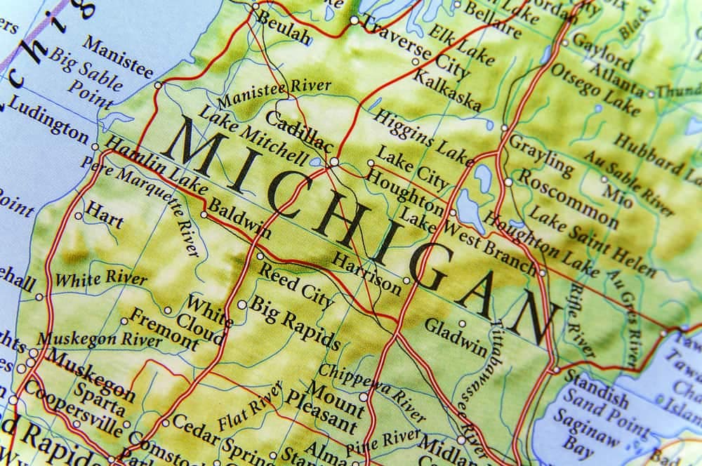 A close-up of a map of Michigan highlighting public spaces and revitalizing initiatives through Spark Grants.