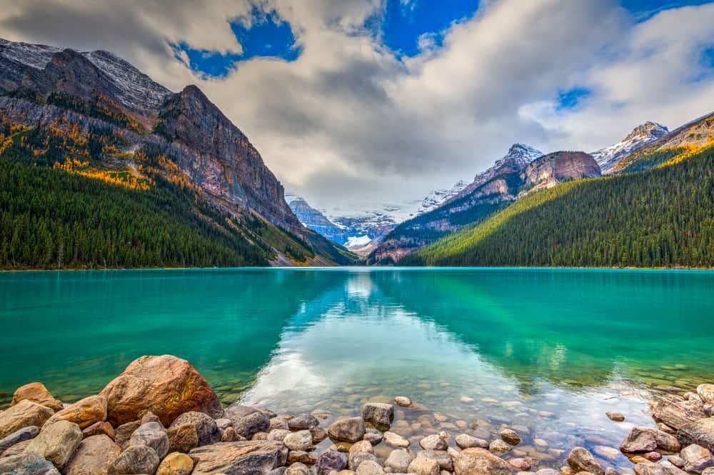 A blue lake surrounded by mountains in Banff National Park, protected by Parks Canada.