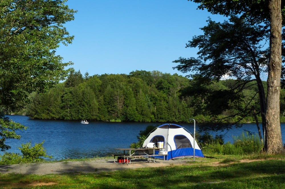 A picturesque blue sky with fluffy white clouds sets the perfect backdrop for camping adventures in Pennsylvania state parks.