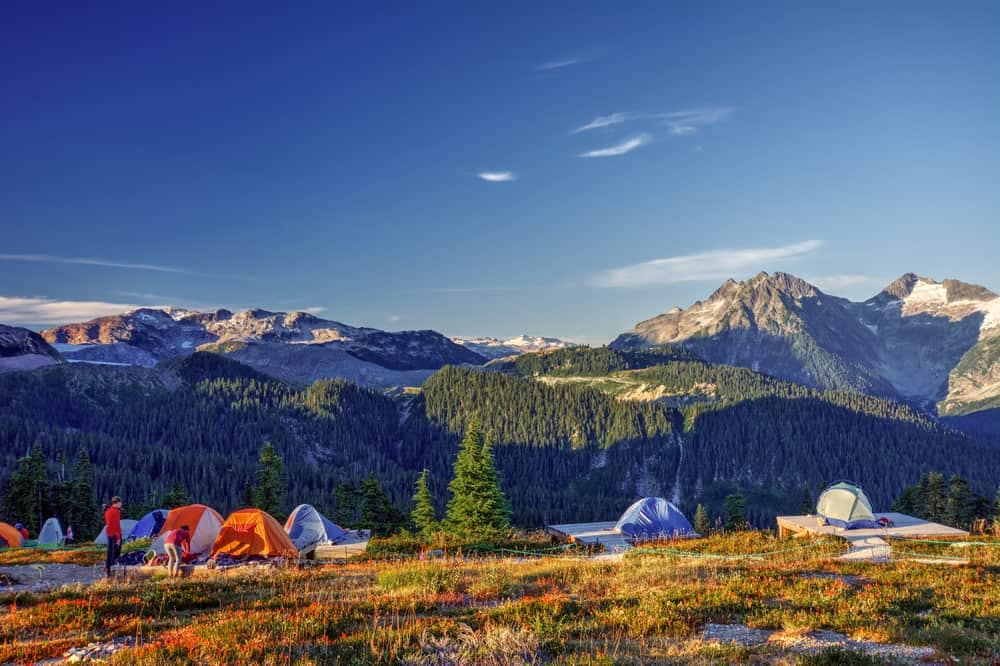 B.C. Campers set up a group of tents in the mountains due to a Lack of Campsite Availability.