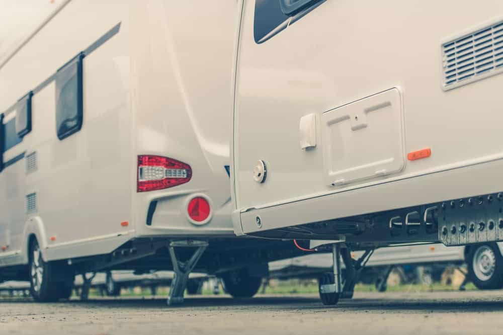 A group of RVs parked in a parking lot, reflecting the decline in Canada RV wholesale shipments according to the CRVA Report.