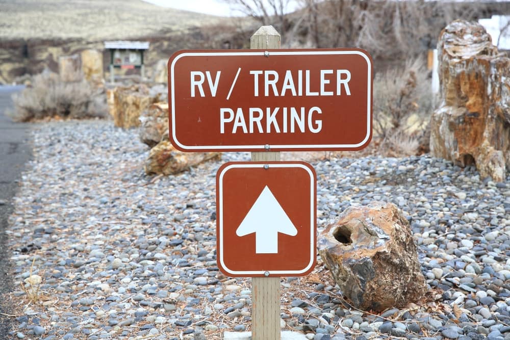 A RV parking sign on the side of a gravel road in Montana.