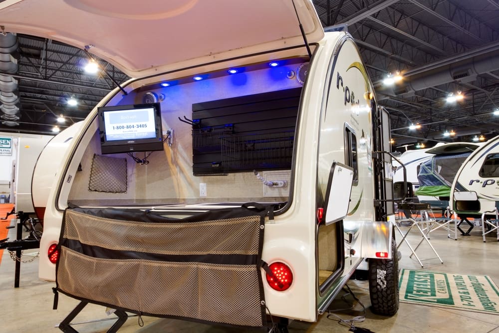 A small RV with a TV in the back showcased at the RV Show in Canada.