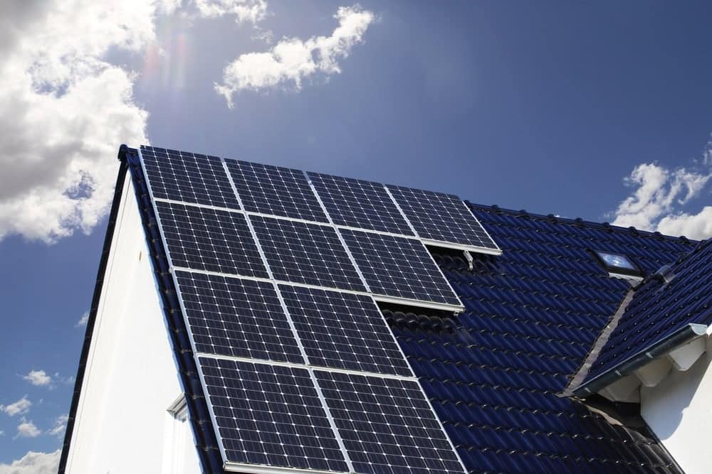 Small solar panels on the roof of a house.