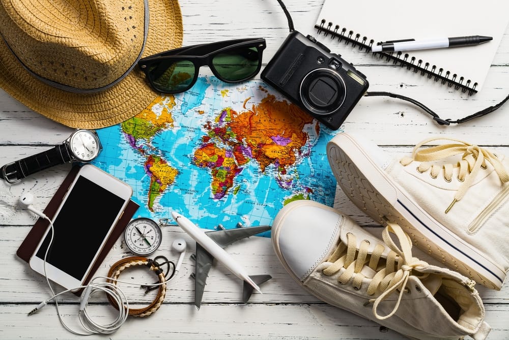 Travel accessories including hat and sunglasses for your Labor Day trip to Florida.
