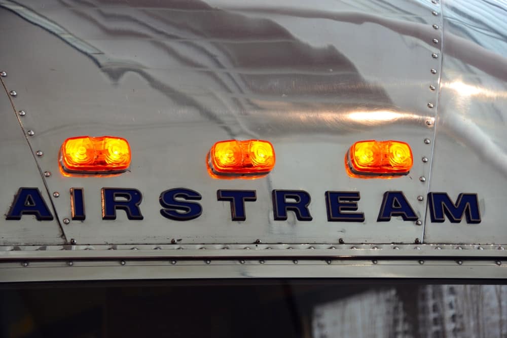 A close up of a silver airplane with the word airstream on it.