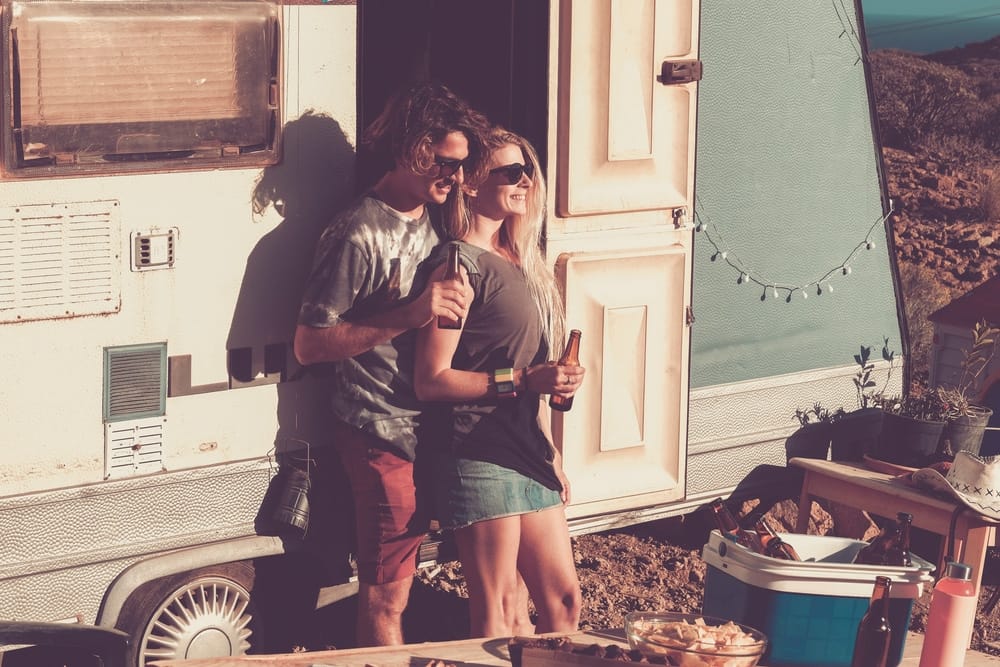 Two people standing in front of a private campgrounds.