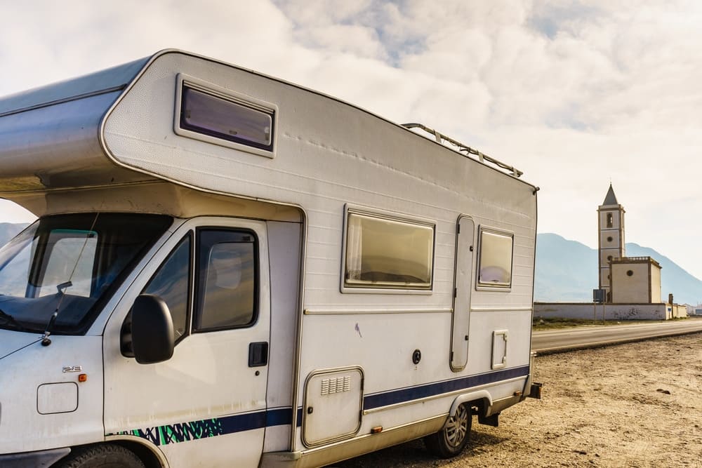 A Church RV parked on the side of the road.