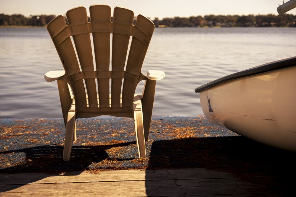 A wooden chair on a dock at a Minnesota campground.