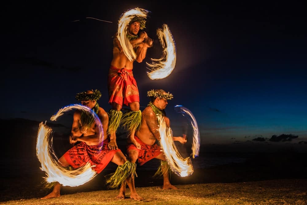 Hawaiian fire dancers mesmerize residents performing at night in Hawaii.