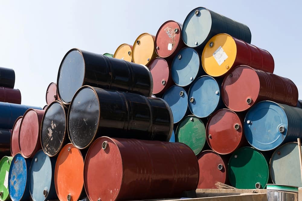 Oil barrels stacked on top of each other, reflecting the current pump prices amid COVID-19 news and fluctuations in the price of oil.