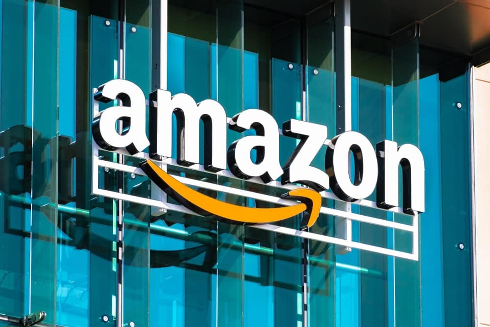 The Amazon logo is seen on the side of a building as part of an outdoor initiative.