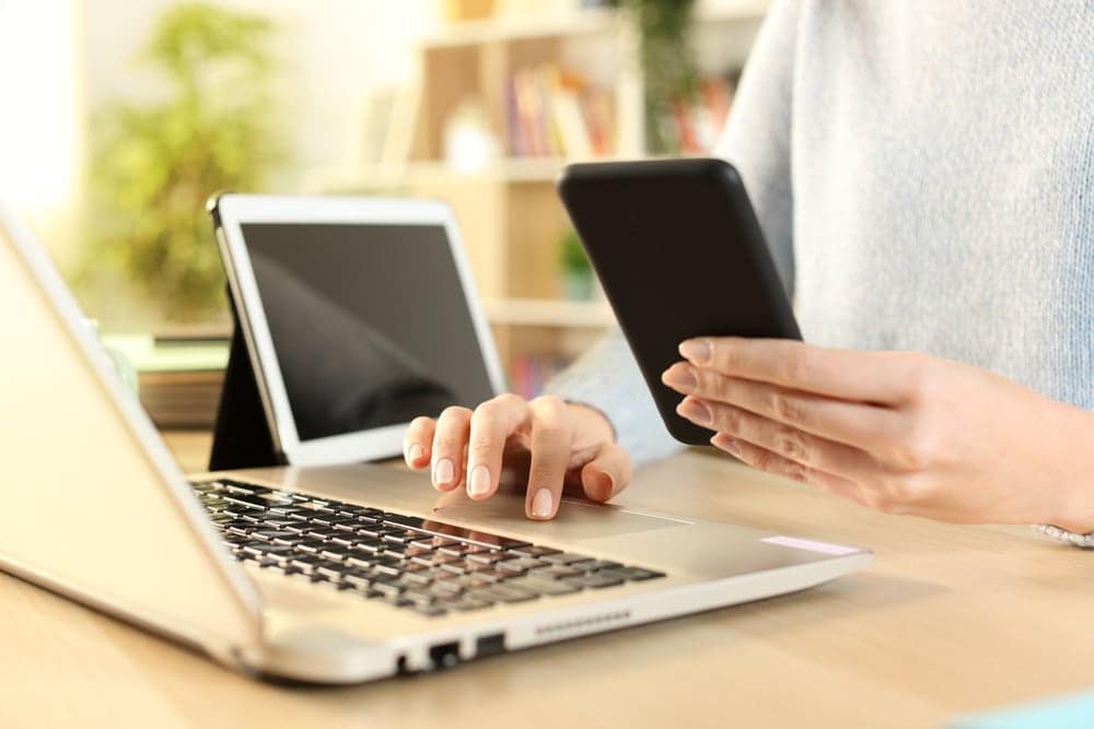 A woman is using a cell phone for growth.