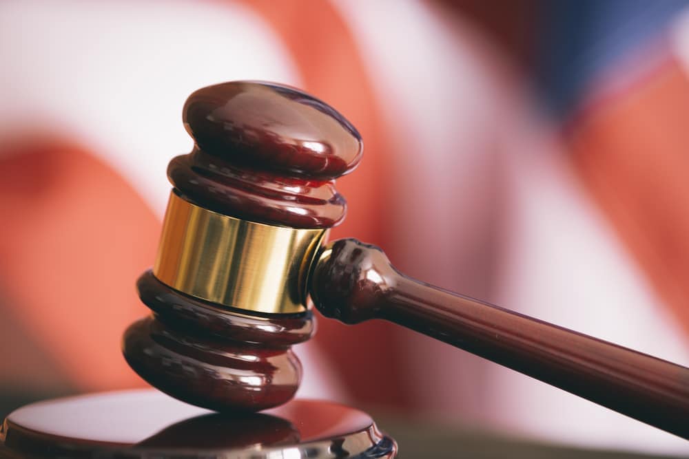 Proposed Changes to Alamance County's RV Park Ordinance showcase a judge's gavel in front of an American flag, causing worry among park owners.
