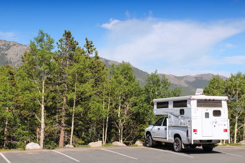 A Great Outdoors RV, sponsored by Colorado, parked in a parking lot.