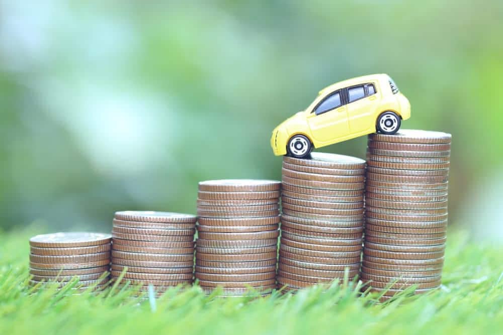 A toy car highlighting the decline in new-vehicle prices.
