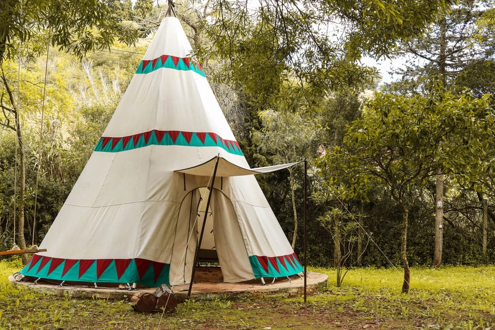 The Colorado Yurt Company prepares a teepee in the woods at Secret Creek.