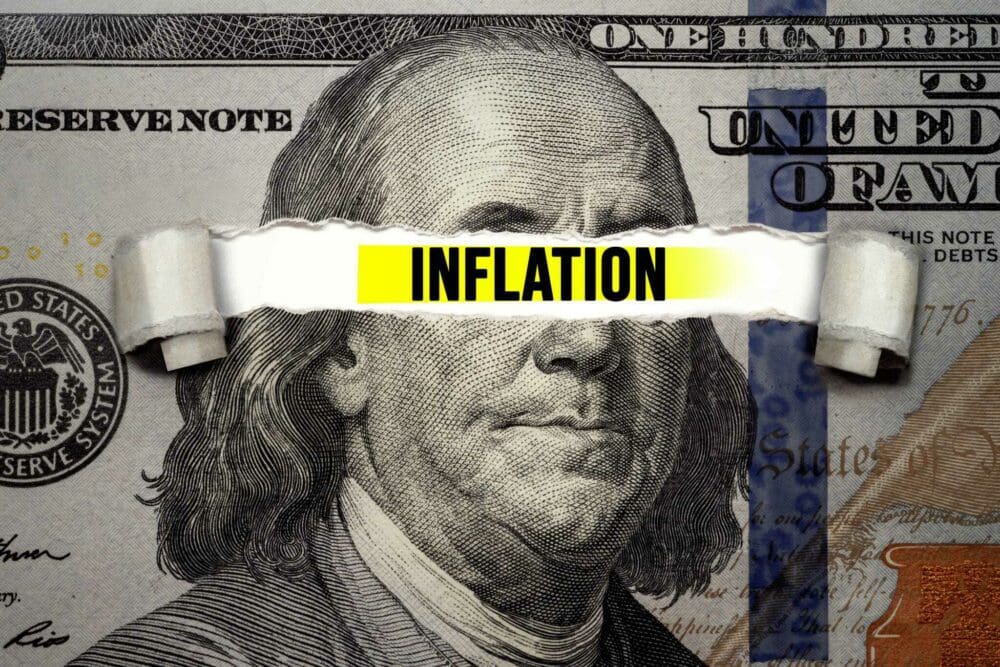 An image of a dollar bill featuring the word inflation, taken from the University of Michigan's consumer sentiment survey.