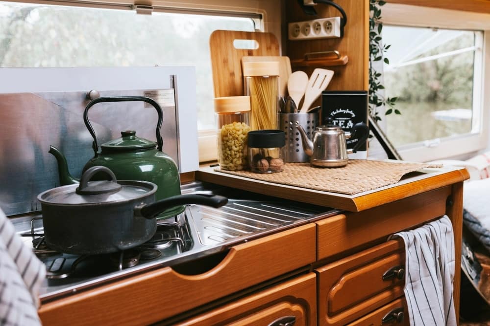 An Alabama couple's RV kitchen equipped with a stove and pots and pans for their winning business pitch.