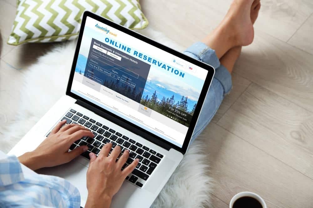 A woman is using a laptop to access the new campground reservation system provided by the Grand River Conservation Authority.