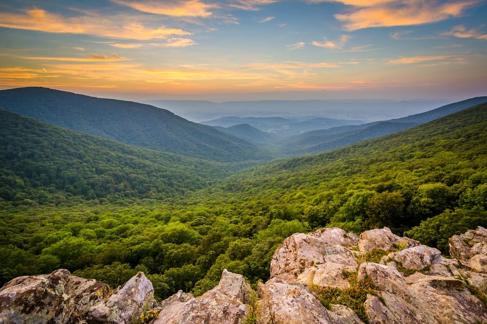 A breathtaking sunset view of the Shenandoah Mountain National Scenic Area, showcasing the majestic mountains and picturesque valleys.