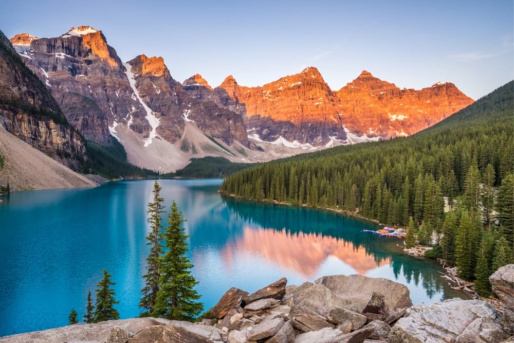 Sunrise over a lake in the mountains of Banff National Park, Parks Canada.