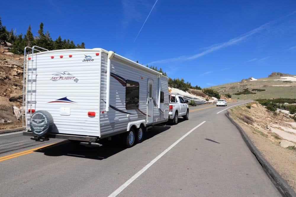 A Jayco RV is parked on the side of a mountain road in Australia.