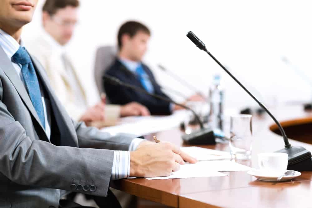 A proposed Community Council representing Homestead Valley, with a group of businessmen sitting at a conference table.