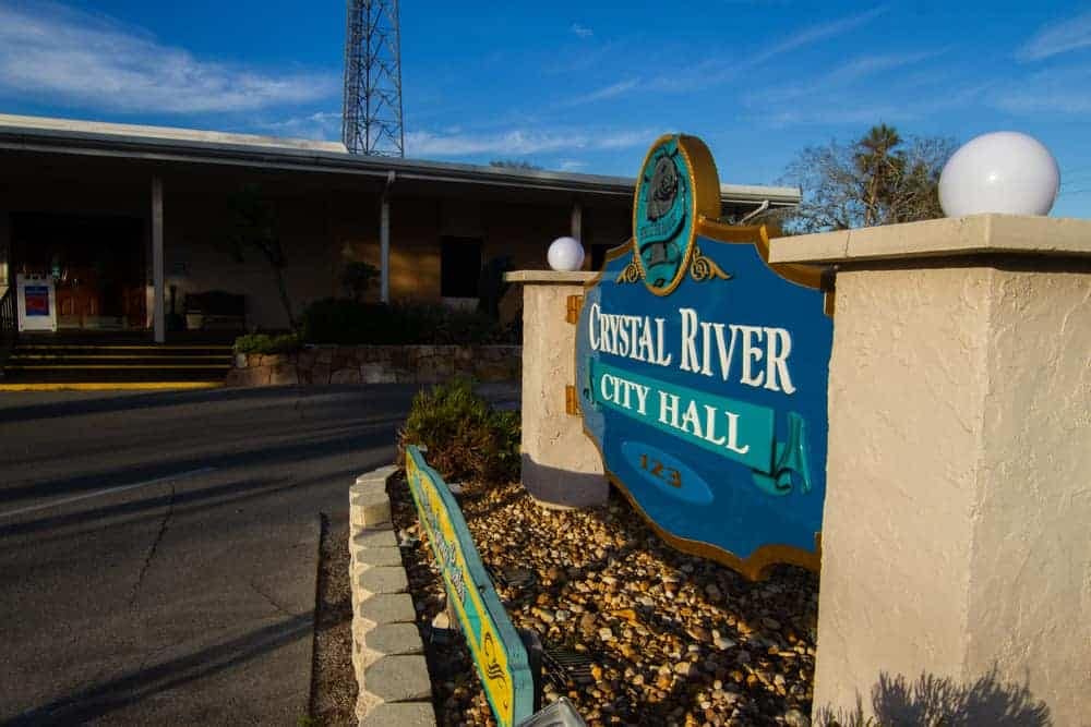 A sign in front of a building that the new Crystal River City Hall.
