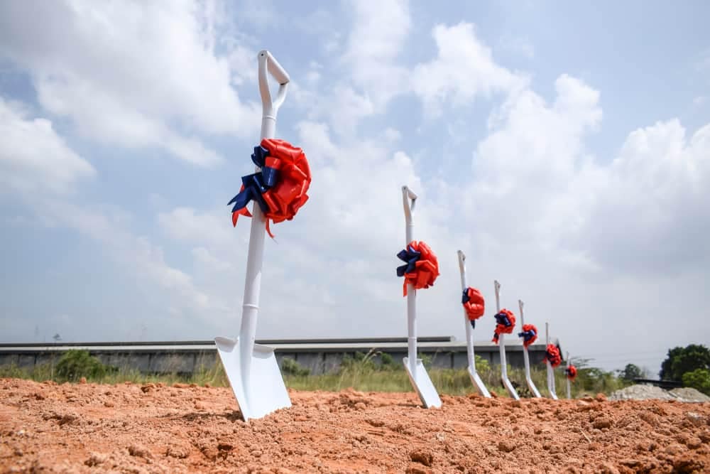 In a Pennsylvania campground, a group of shovels with red and blue ribbons are left in the dirt.