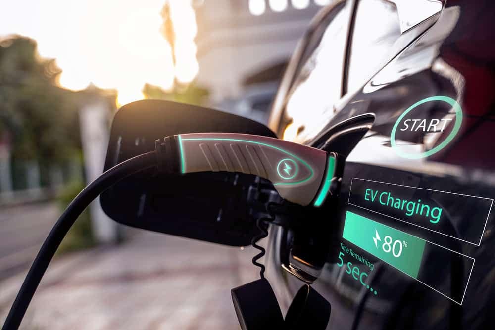 An electric vehicle (EV) is plugged into a charging station at an Oregon State Parks as part of a Pilot Project for EV Chargers.