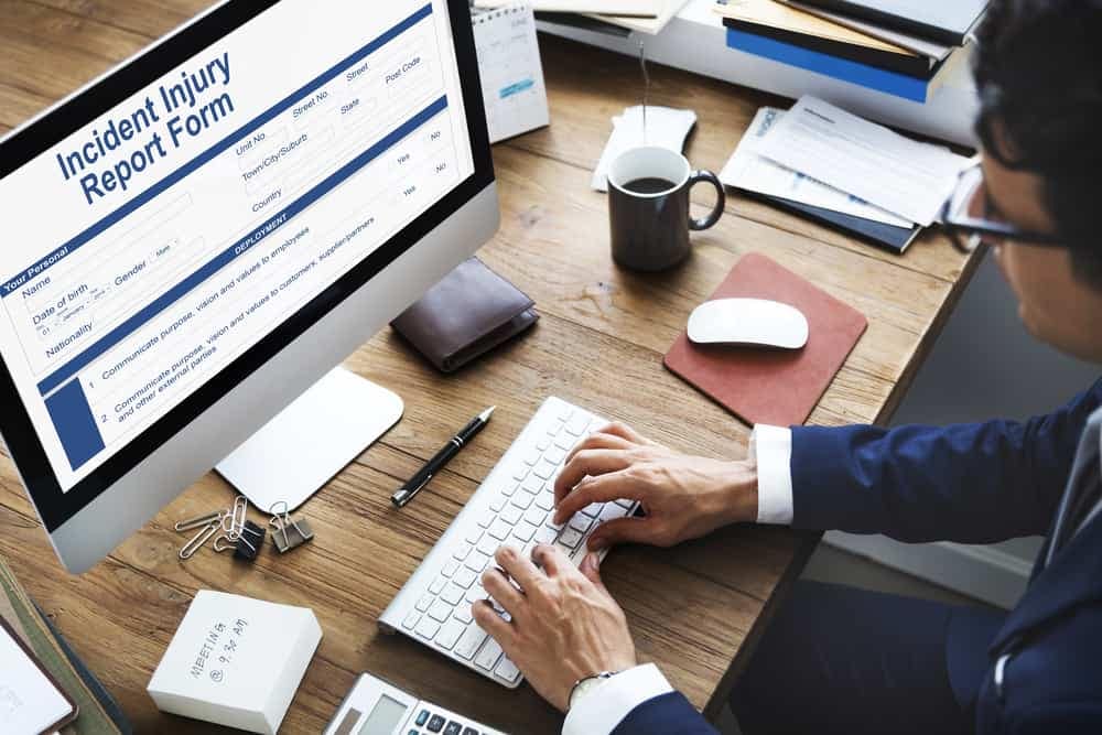 A man conducting online incident investigation on a computer screen.